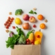bag of vegetables and fruit, apples, tomatoes, sweetcorn, broccoli
