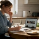 Woman recording allergy symptoms at kitchen table