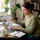 Woman reviewing allergy checklist at home desk
