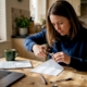 Woman collecting hair sample at kitchen table