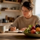 Mother recording child's food elimination diary
