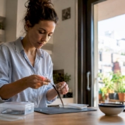 Woman collecting hair sample for intolerance test