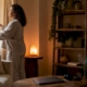Woman opening blackout curtains in calm morning