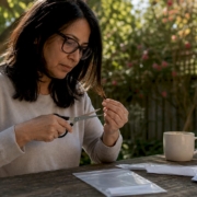 Woman preparing hair sample at home