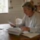 Woman unpacking at-home intolerance test kit at table
