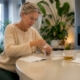 Woman preparing at-home test kit in kitchen