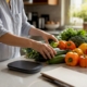 Hands arranging fresh foods for diet elimination