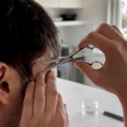 Person cutting hair for bioresonance sample