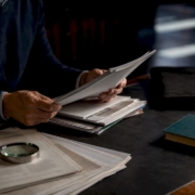 Hands reviewing bioresonance evidence documents