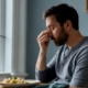 Person noticing nasal congestion after a meal