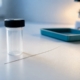 Hair sample beside laboratory container