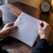Hands opening an intolerance test report