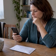 Woman comparing at-home test booking options
