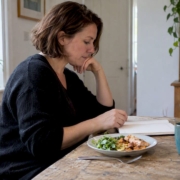 Woman reviewing migraine food elimination steps