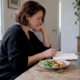 Woman reviewing migraine food elimination steps