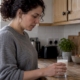 Adult assessing a glass of cow's milk