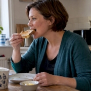 Woman eating wheat toast before testing