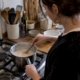 Oats simmering in a saucepan on a hob