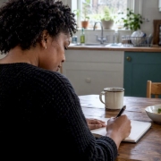 Woman recording a food and symptom diary
