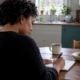 Woman recording a food and symptom diary