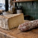 Aged cheese and fermented sausage at a deli