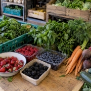 Fresh berries, herbs and vegetables at produce counter